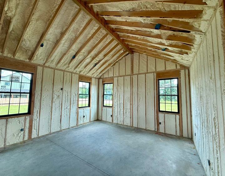 Room with spray foam insulated walls and windows